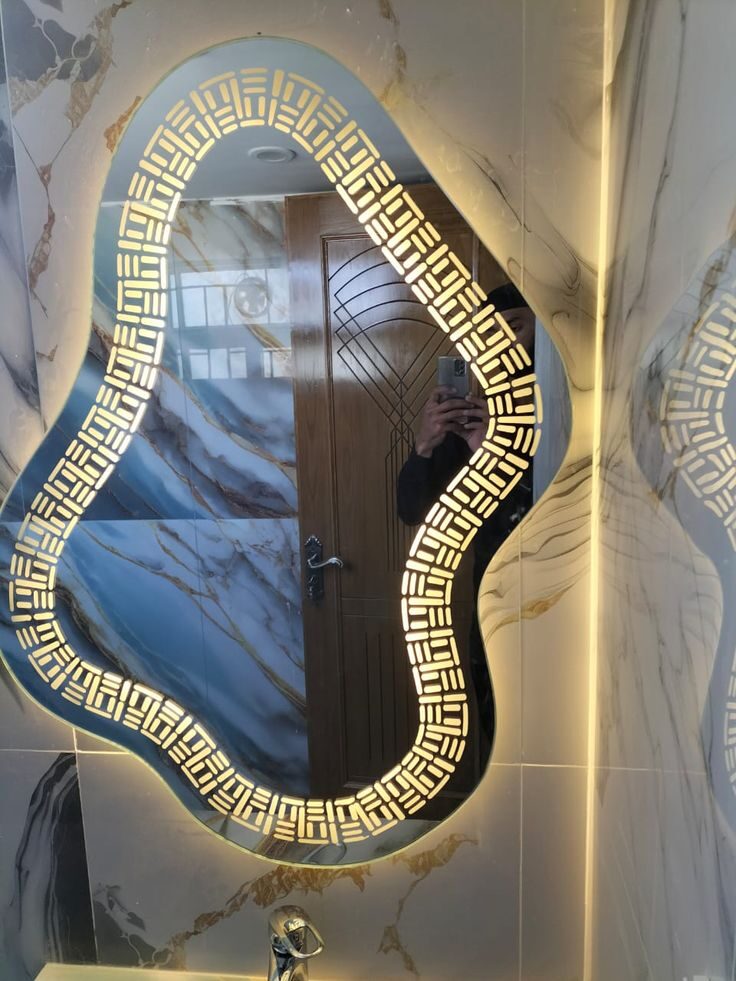 Pebble Cluster — irregular organic-shaped LED mirror with halo glow, made to order by Lume