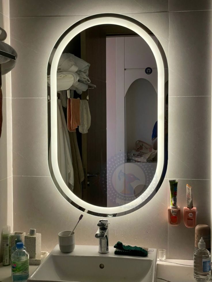 Blossom Branch — oval capsule LED mirror with border lighting, made to order by Lume