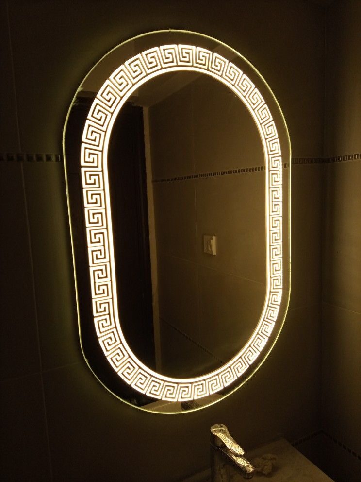 Capsule Marble Cool — oval capsule LED mirror with border lighting, made to order by Lume