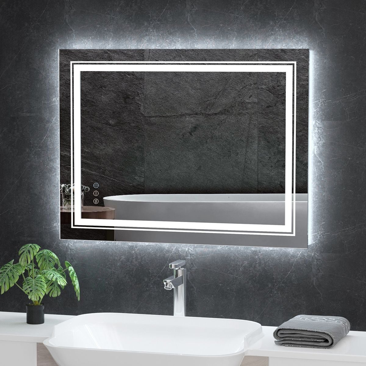 Lume designer LED mirror with pixel frosting pattern glowing on a dark bathroom wall