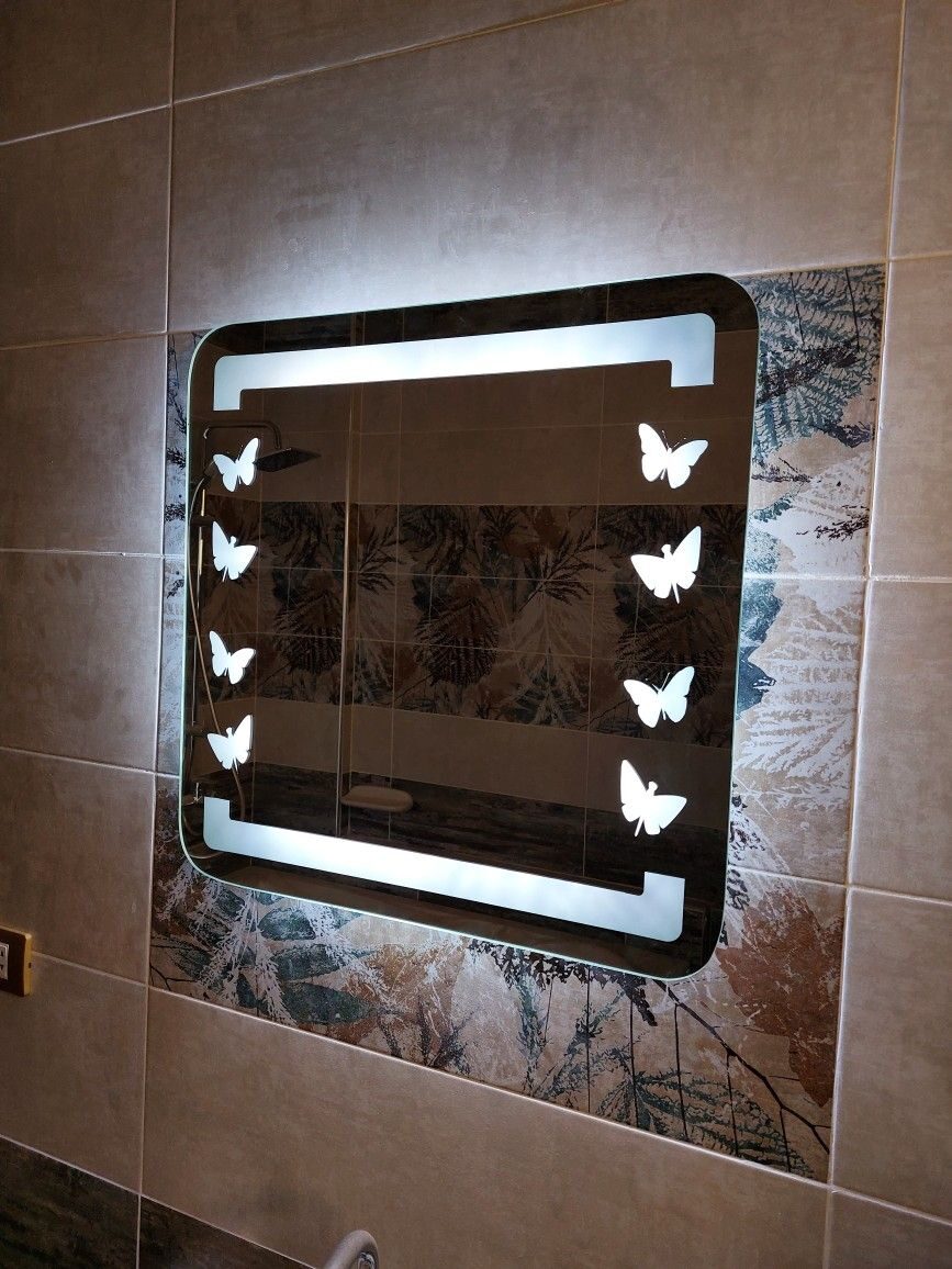 Precision laser-frosted glass panel with geometric LED pattern